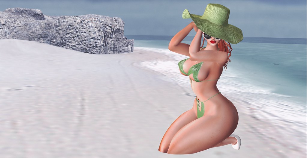 A digital female avatar in a green bikini and large sun hat kneels on a white sand beach. — illustrating “An Ode to the Cheesecake Factory” on Florence and Mary