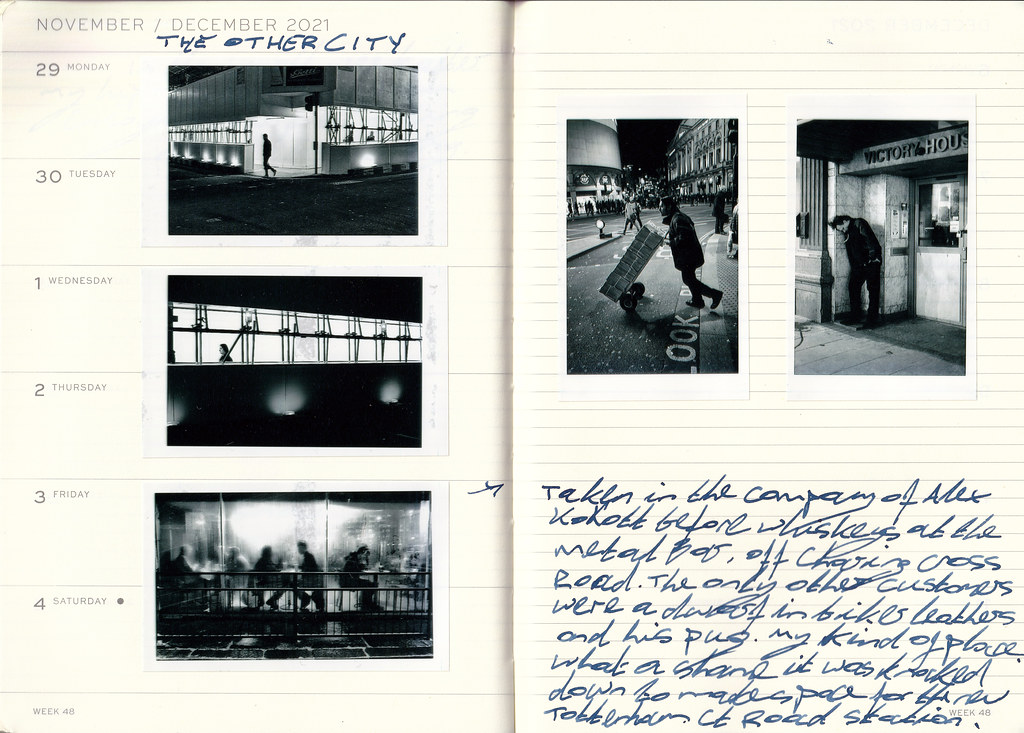 An open cream planner shows five black-and-white street photos taped beside blue handwritten notes. — illustrating “BEDM: First Job” on Florence and Mary