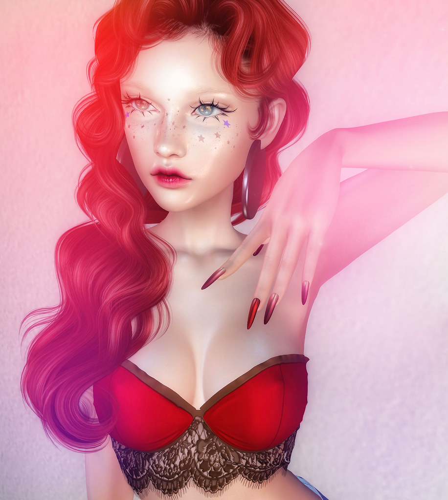 A digital illustration of a red-haired woman with purple star freckles, red lace top, and pointed nails. — illustrating “My Nail Kit” on Florence and Mary