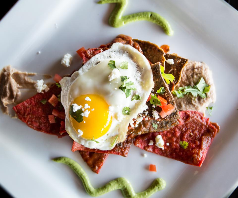 Sunny-side-up egg atop red and brown tortillas with cheese, cilantro, and green sauce swirls. — illustrating “OOTD // Topshop Tattoo Flower Tea Dress” on Florence and Mary