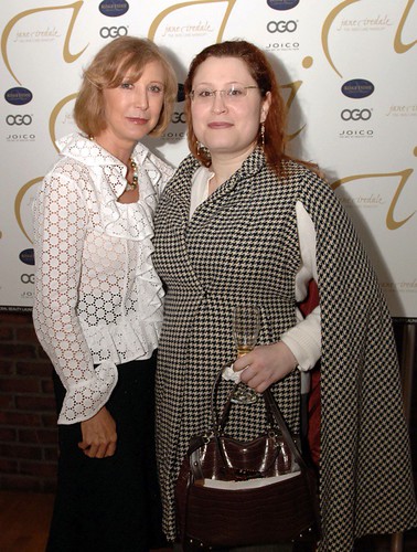Two women in a white eyelet blouse and houndstooth cape pose before a Jane Iredale backdrop. — illustrating “Product Fail | Rimmel Exaggerate Undercover Shadow Primer” on Florence and Mary