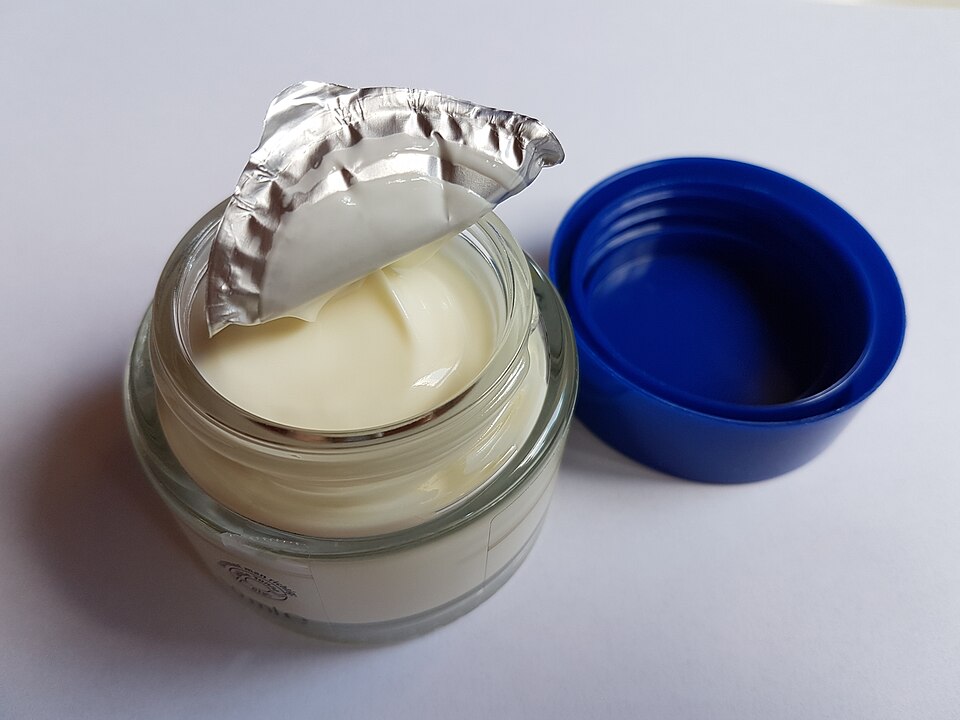Open glass jar of thick off-white cream with peeled silver foil seal and bright blue lid. — illustrating “Review // Erborian BB Creme Au Ginseng” on Florence and Mary
