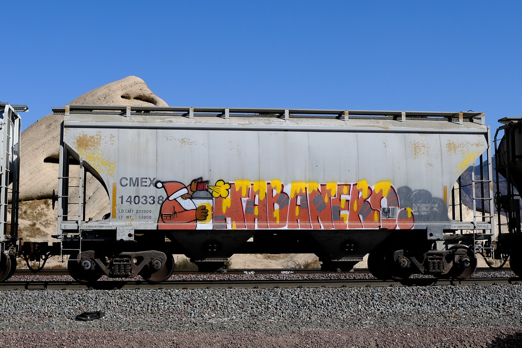 A gray hopper train car shows colorful Santa graffiti spelling HABANERO against blue sky. — illustrating “What I got for Christmas | Beauty” on Florence and Mary