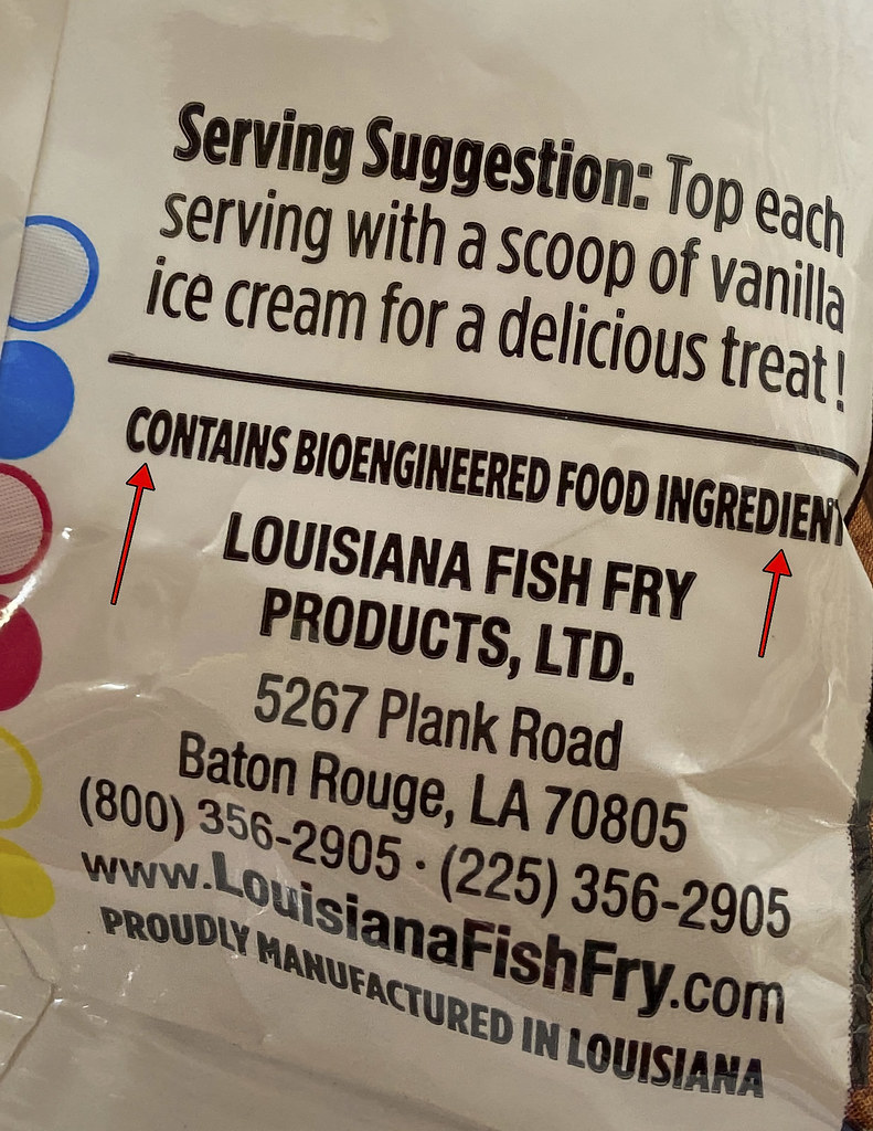 A white food package close-up shows bioengineered ingredients text with two red arrows pointing. — illustrating “What I've Been Reading | Jan - Feb 2015” on Florence and Mary